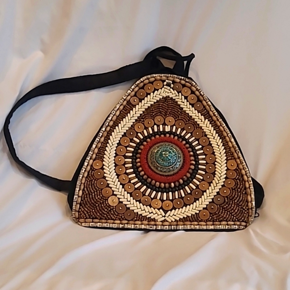Small unbranded, handmade, backpack purse. Amazing bead work.